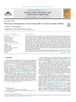 Numerical investigations of rock bridge effect on open pit slope stability
